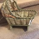 Photo of Vintage wicker doll cradle